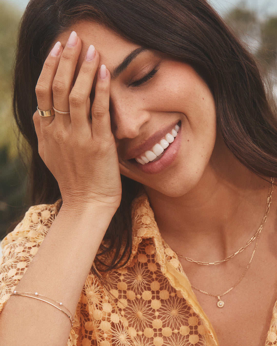 model wearing 14k gold and new gemstones