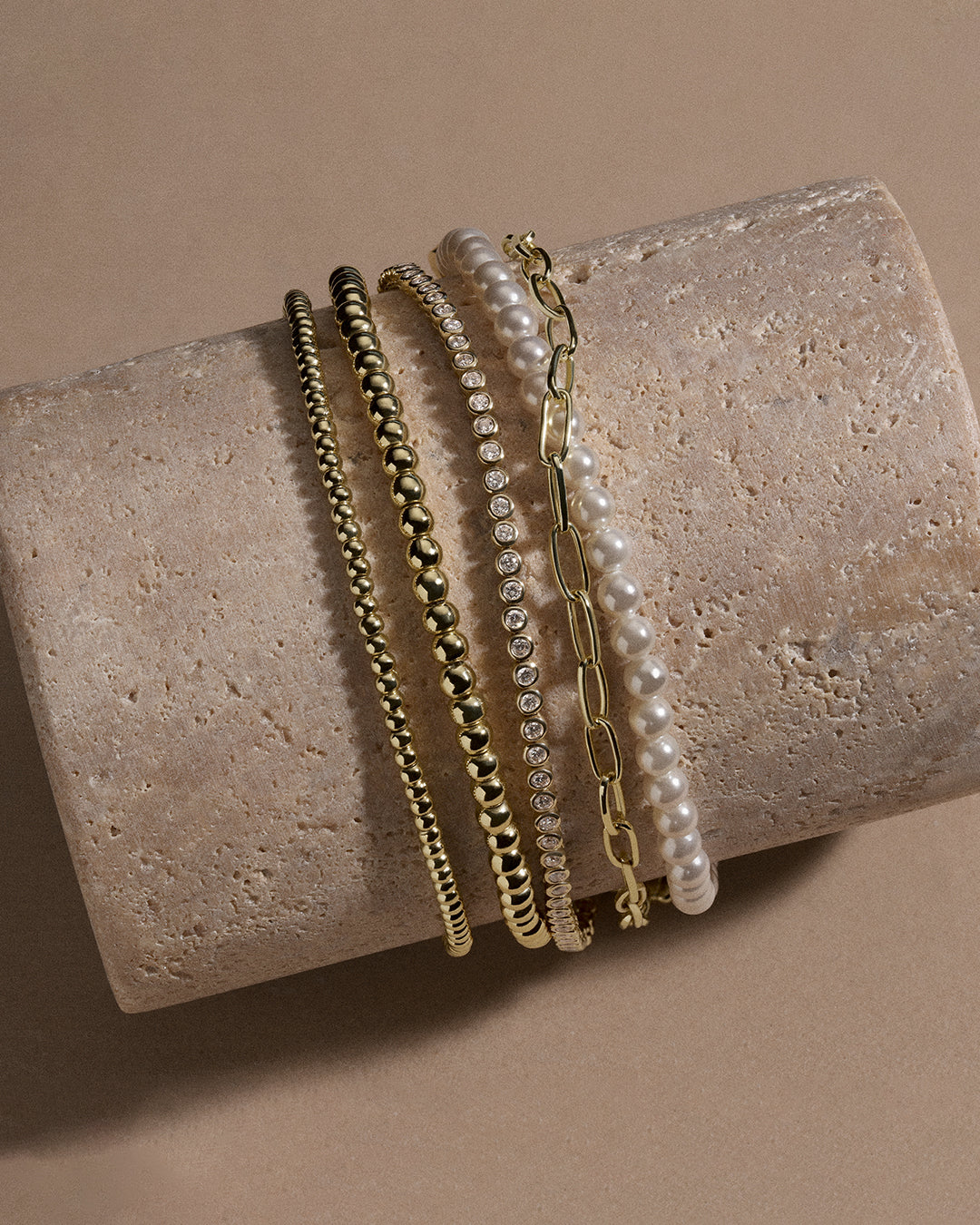 gold plated, pearl and diamond bracelets